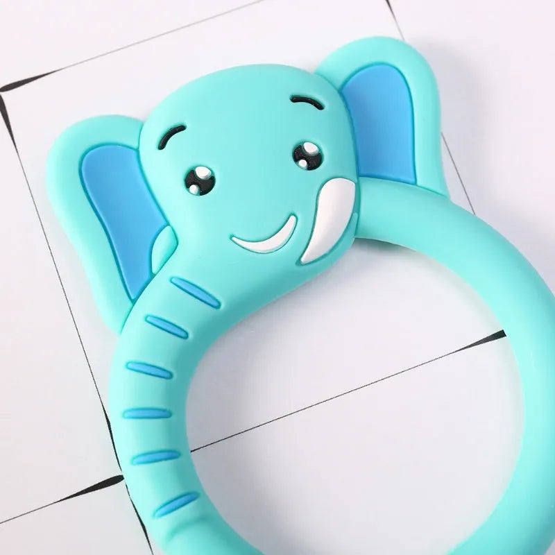 Three baby molar silicone teethers in brown, blue, and yellow on a white background