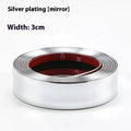Roll of carbon diamond particle car door edge protector strip in black on a textured surface