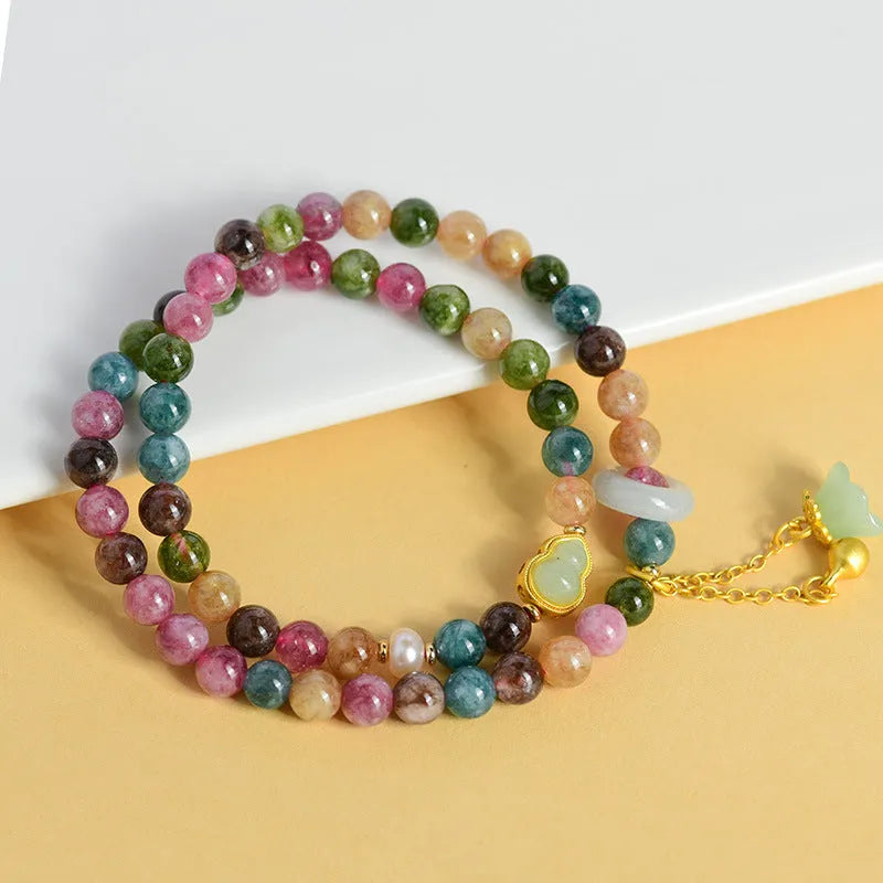 Close-up of a women's double ring bracelet made from round natural chalcedony crystal beads.