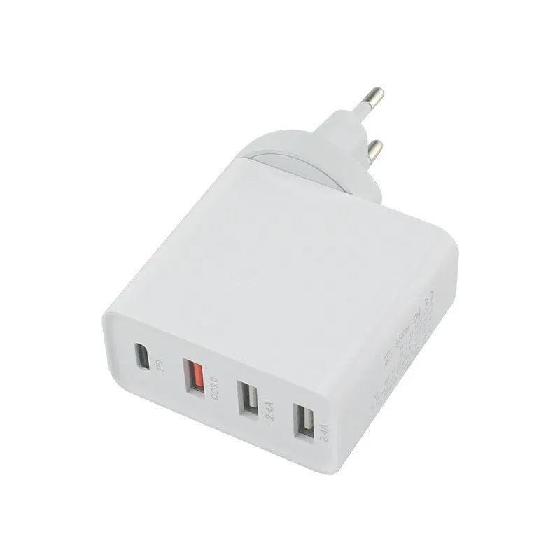 Black four-port USB-C wall charger with UK, US, EU, and AU plug adaptors on a white background.
