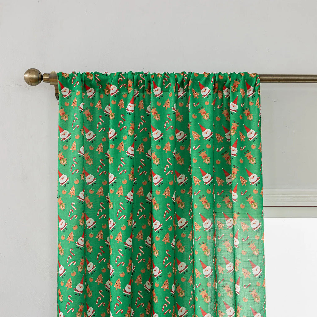 Green Christmas curtain with cartoon snowman and angel print, 1 metre wide.