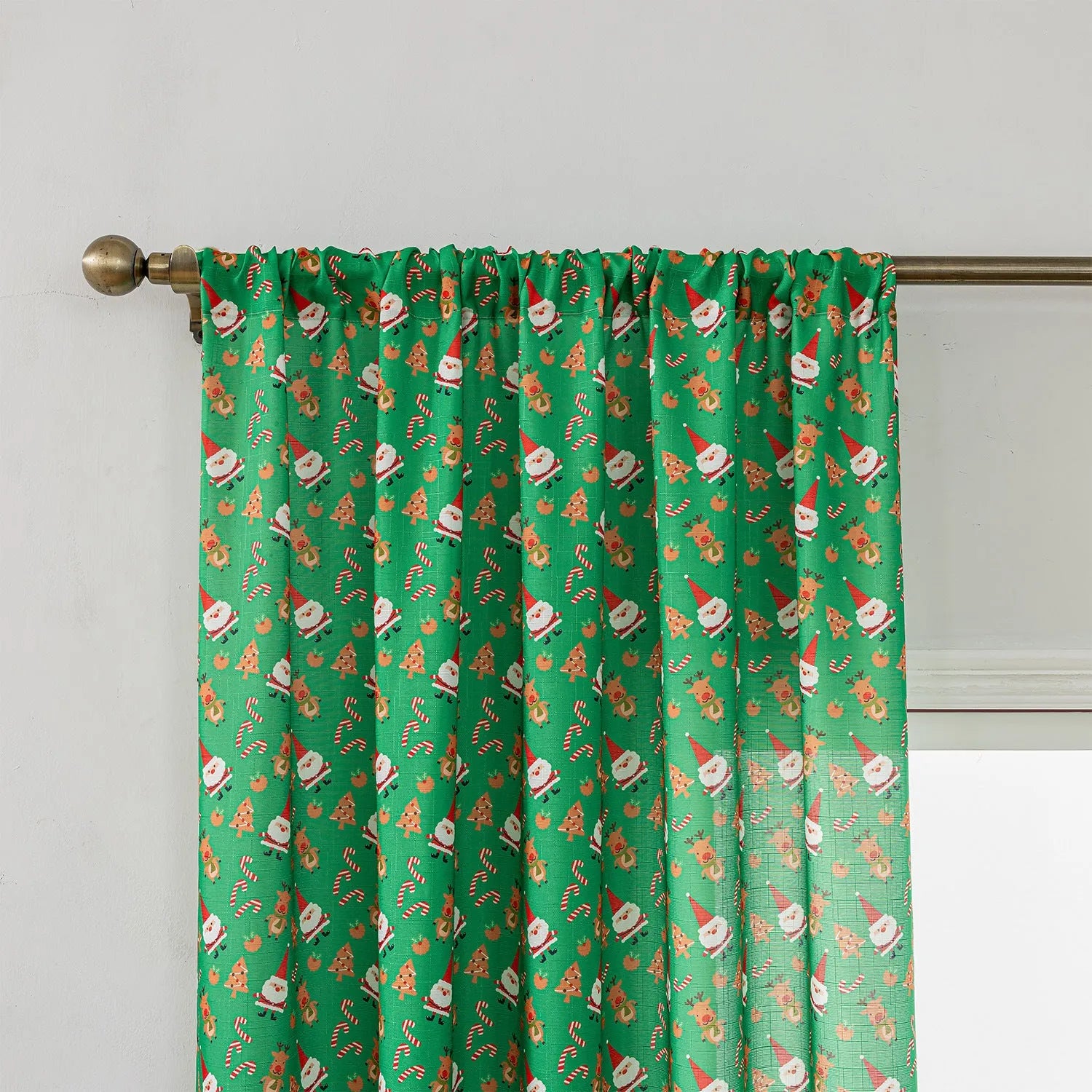 Green Christmas curtain with cartoon snowman and angel print, 1 metre wide.