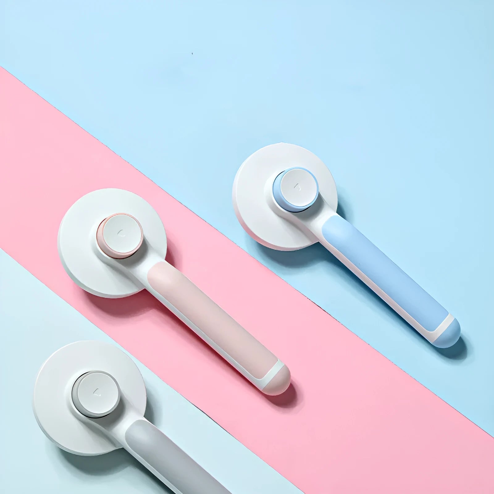 Round handle pet pass-through comb with stainless steel needles and self-cleaning button in pink colour