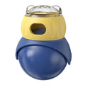 Morandi yellow and blue owl-shaped plastic puzzle feeder for cats on a wooden floor.