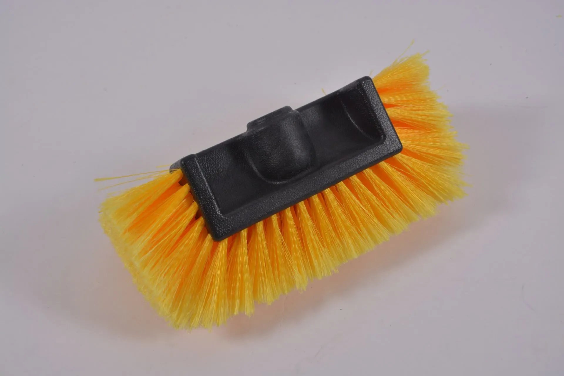 Yellow portable car wash brush with four-section removable rod and flow-through brush head design
