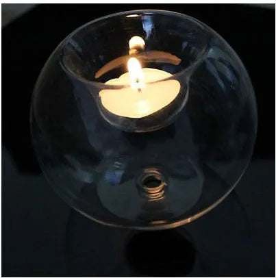 Clear handmade hollow glass spherical candle holder in European style.