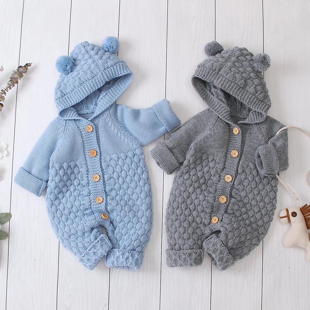 Baby knitted jumpsuit in blue, full-length with button front and hand flaps