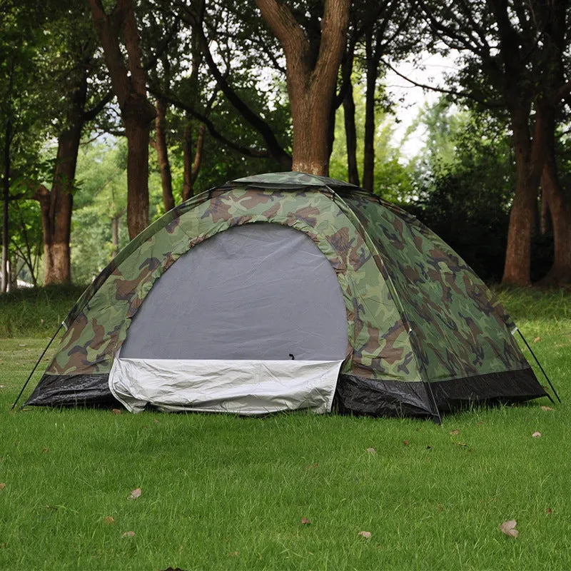 Green camouflage tent with steel ground nails and breathable mesh sections for outdoor camping