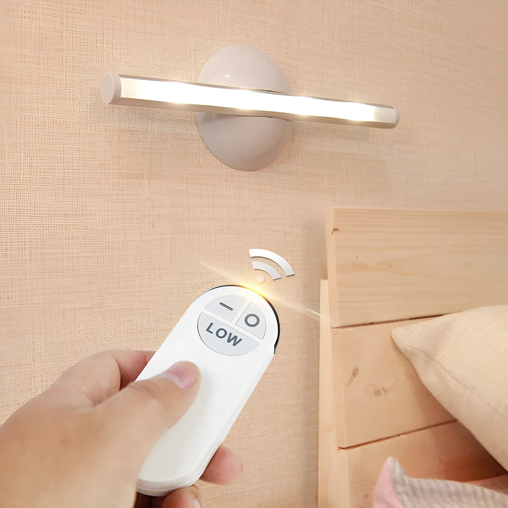 White remote control LED night light lamp on a wooden surface.