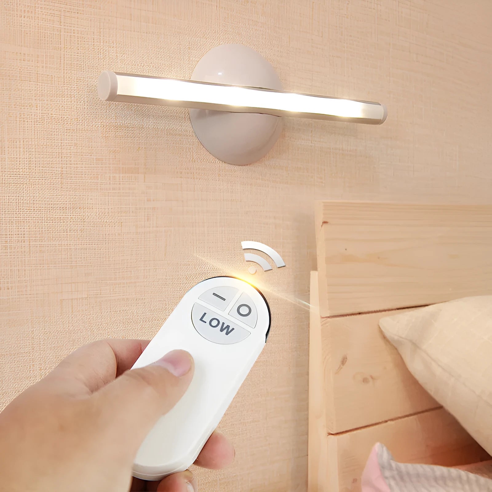 White remote control LED night light lamp on a wooden surface.