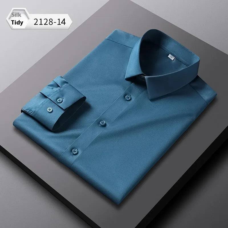 Men's loose fit long-sleeved non-ironing shirt in a solid colour, made from breathable polyester spandex fabric.