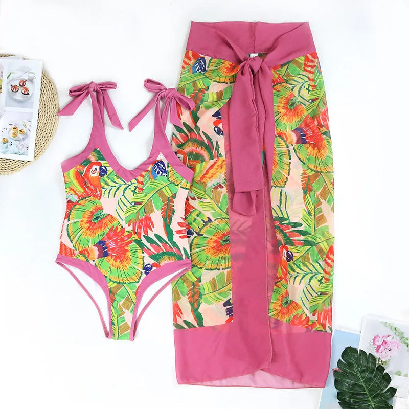Pink floral print retro one-piece swimsuit with V-neck, covered belly, and thin skirt swim dress design