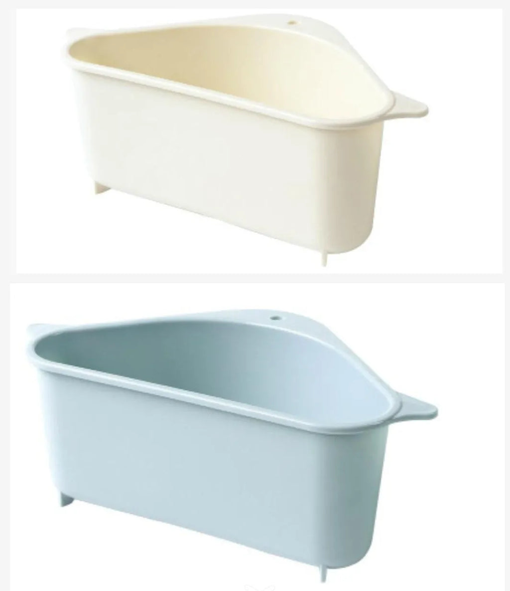 Beige plastic triangle kitchen sink rack holding a sponge and soap, hanging from a faucet.
