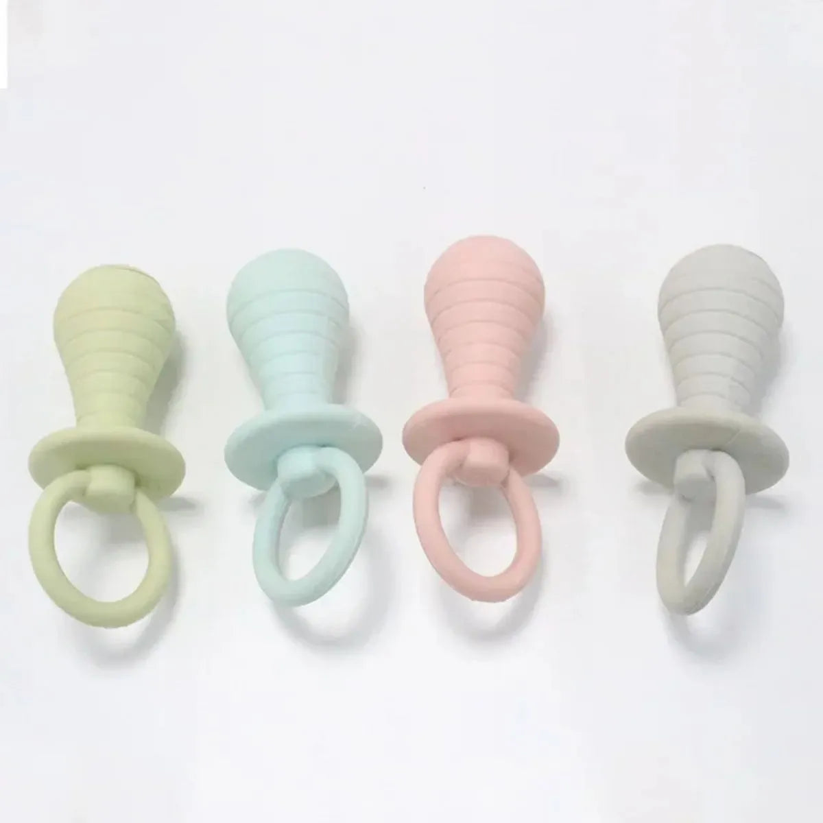 Set of four TPR rubber pet pacifier chew toys with squeakers in blue, gray, green and pink colours