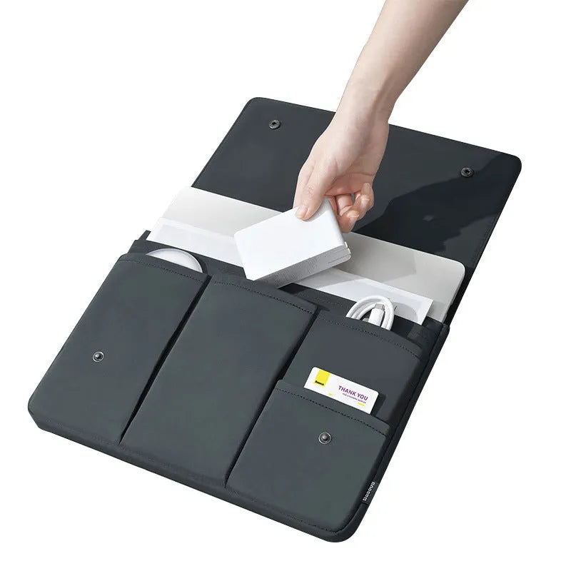 Black and white nylon laptop bag protective cover with flip opening and multiple pockets, available in 13-16 inch sizes.