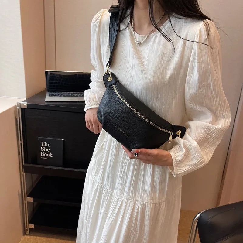 Waist bag with single shoulder design, PU material, medium soft texture, zippered compartment, splicing detail, available in black pink white colours.