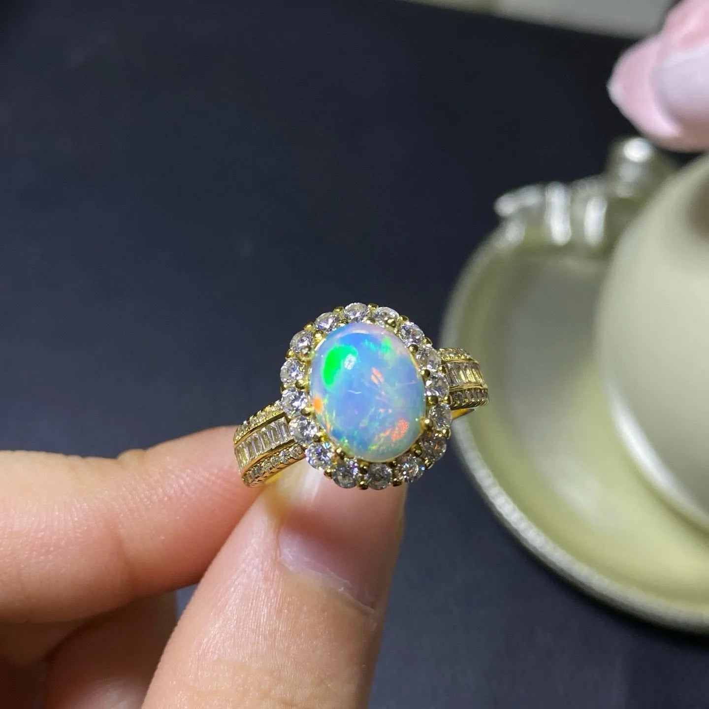 Handmade women's silver opal ring with an opening design, shown in a choice of colour plating.