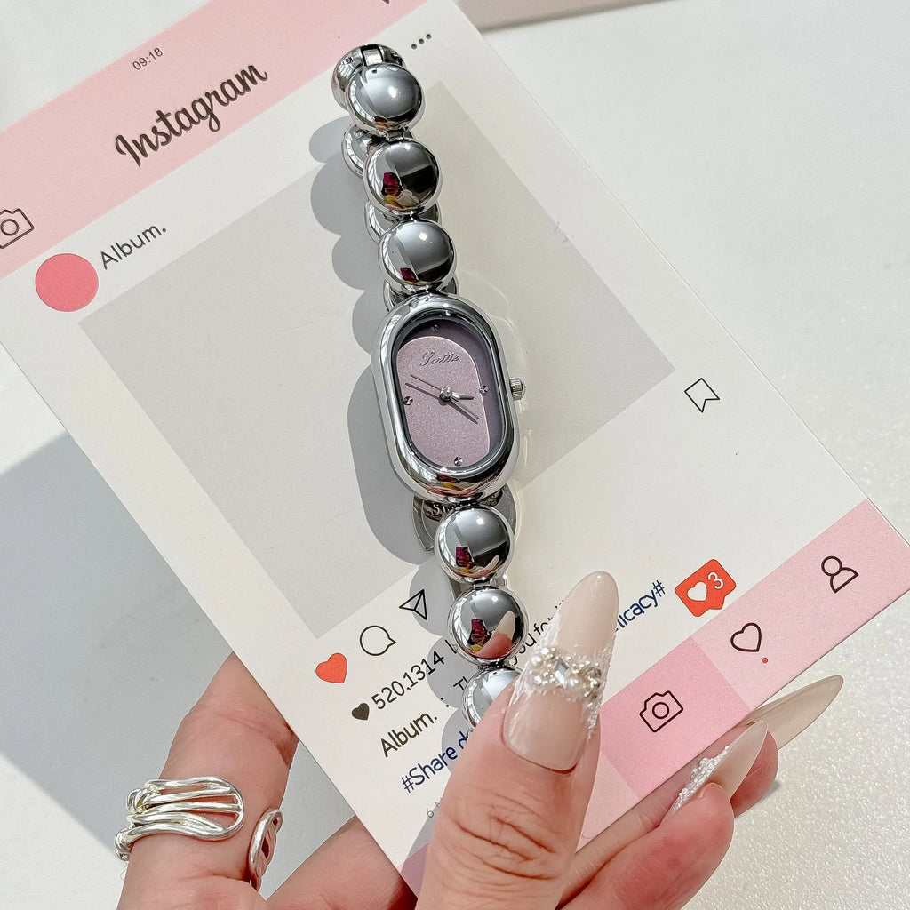 Women's oval fashion watch with bracelet strap in one of seven colour options.