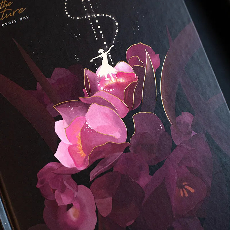 A5 notebook with luminous holographic cover open to show colour illustration on inside pages.