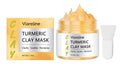 Yellow turmeric mud facial mask with application brush on wooden surface