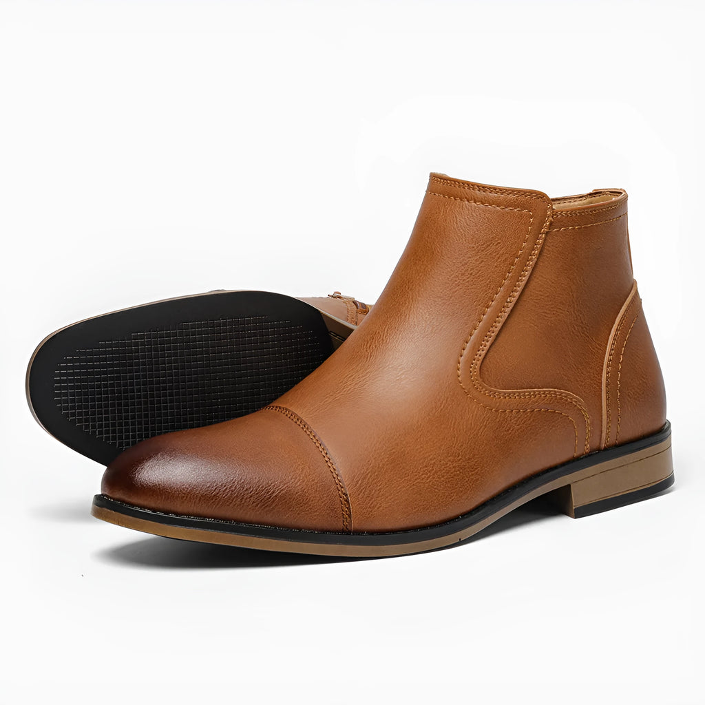 Men's brown Chelsea boot with a side zipper, round toe, and low wooden sole.