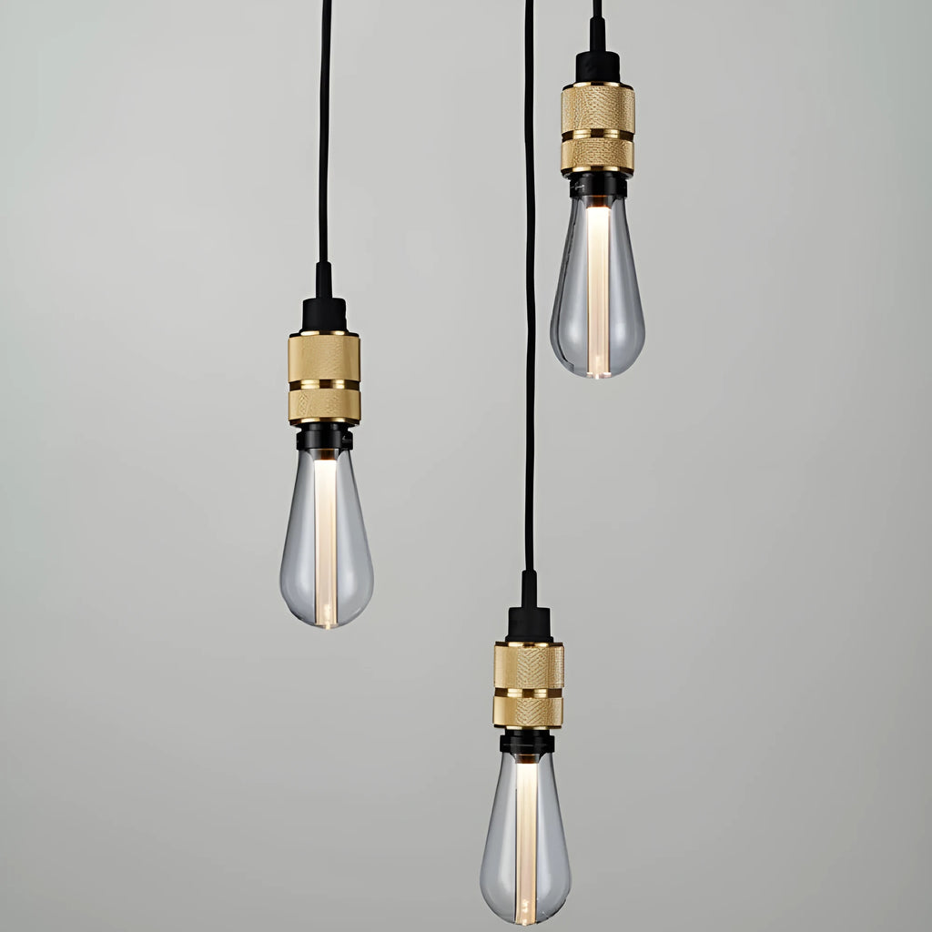 DIY retro chandelier ceiling light kit showing metal lamp holders and woven black cord.