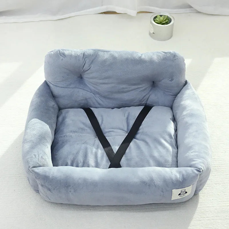 Grey and blue plaid cloth car-mounted pet nest bed for small dog travel.