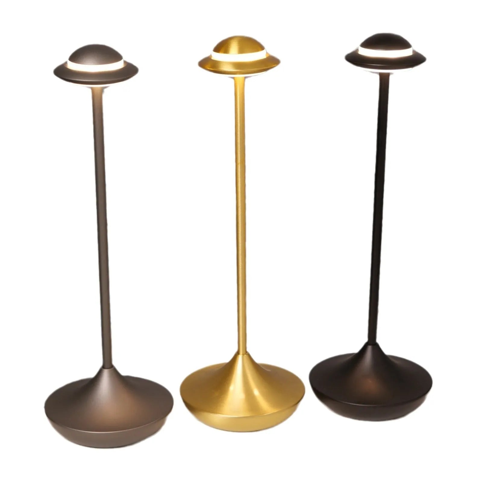 Modern UFO-shaped metal table lamp in black on a wooden desk, showcasing its rechargeable, touch-dimming design.