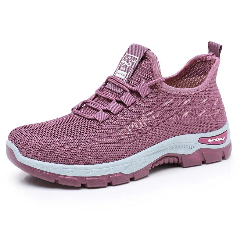 Casual low-top sneaker with soft PVC sole in men's black and women's light purple colour options.