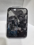 Black Kevlar hard shell case for Apple MagSafe power bank, shown in 3K round hole bright finish.