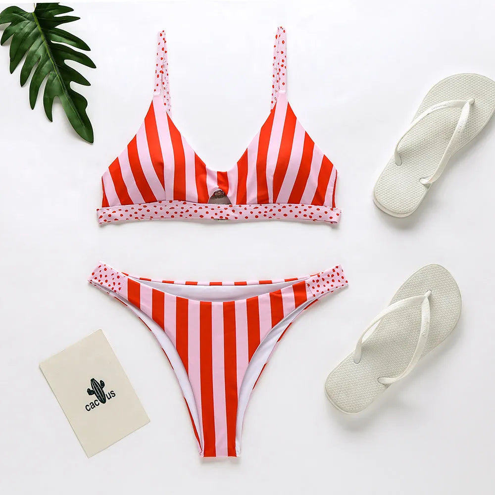 Women's black and white dot bikini set and red and white stripe bikini set laid flat.