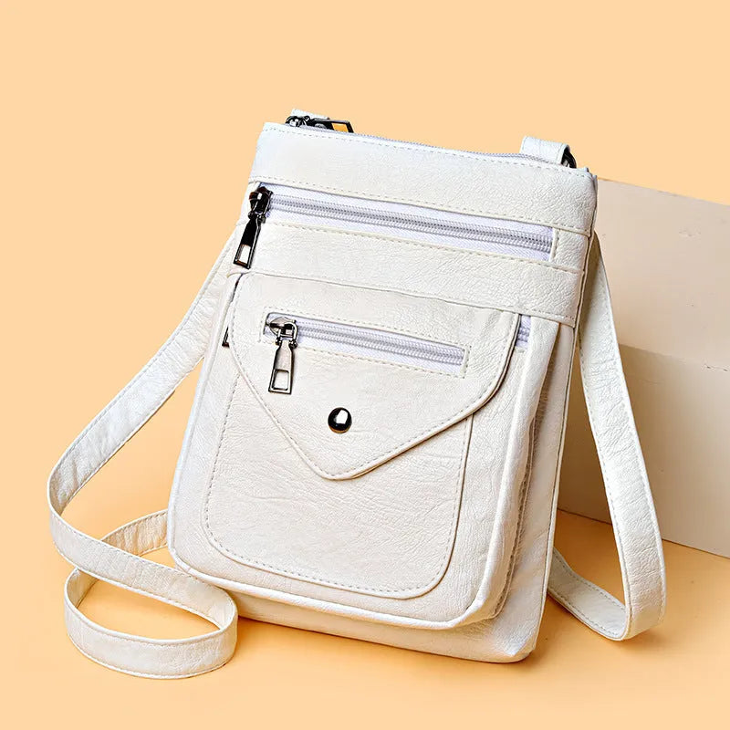 Vertical square crossbody phone bag in pu leather with sewing line detail and crossbody strap