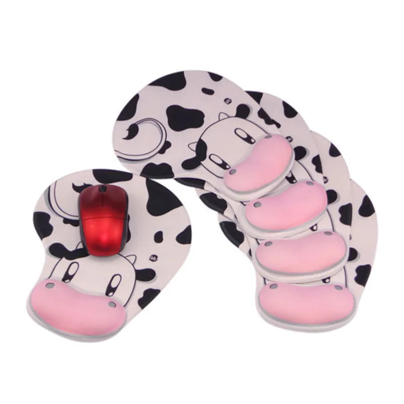 Super soft silicone cow pattern wrist rest mouse pad on a desk, showing non-slip base and ergonomic hand support.
