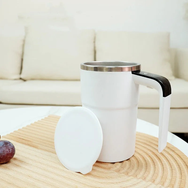 Black electric coffee mug with automatic magnetic stirring and LCD temperature display