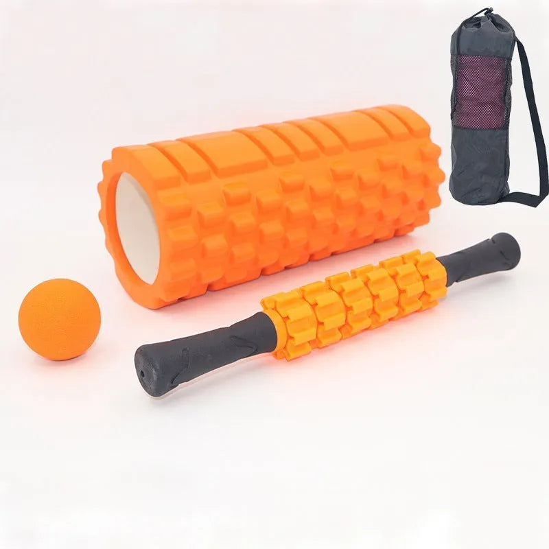 Black 33cm long foam roller massage stick with gear bar design on a grey background.