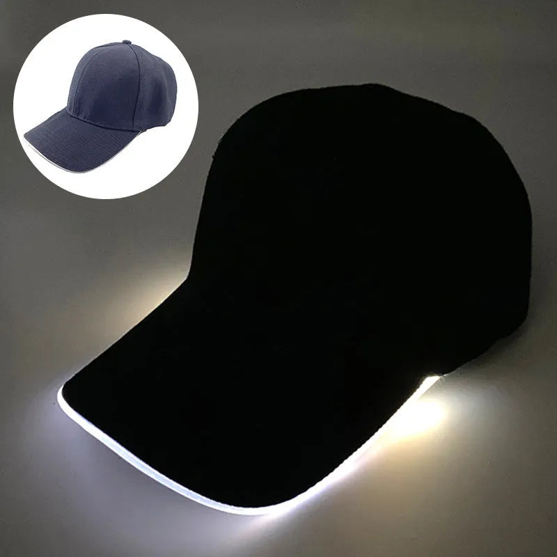 Black Halloween baseball cap with LED pumpkin smile face and yellow lights illuminated.