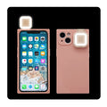 Ring flash mobile phone case for iPhone 13 in solid colour options on a pink background.