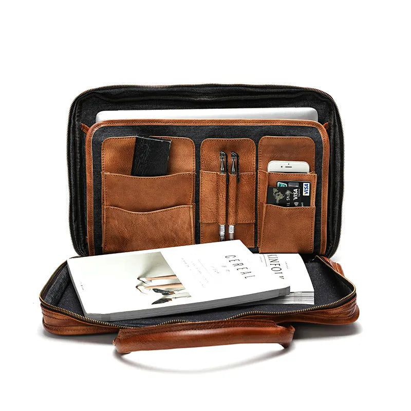 Brown vintage leather men's briefcase showing internal organiser pockets and laptop sleeve.
