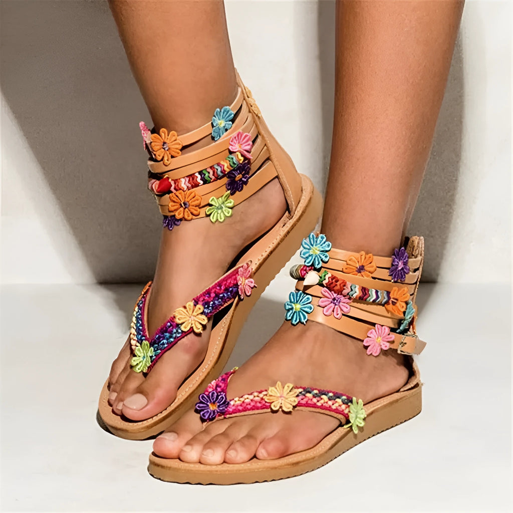 Women's ethnic beaded petal sandals in synthetic PU leather with floral design and round toe.