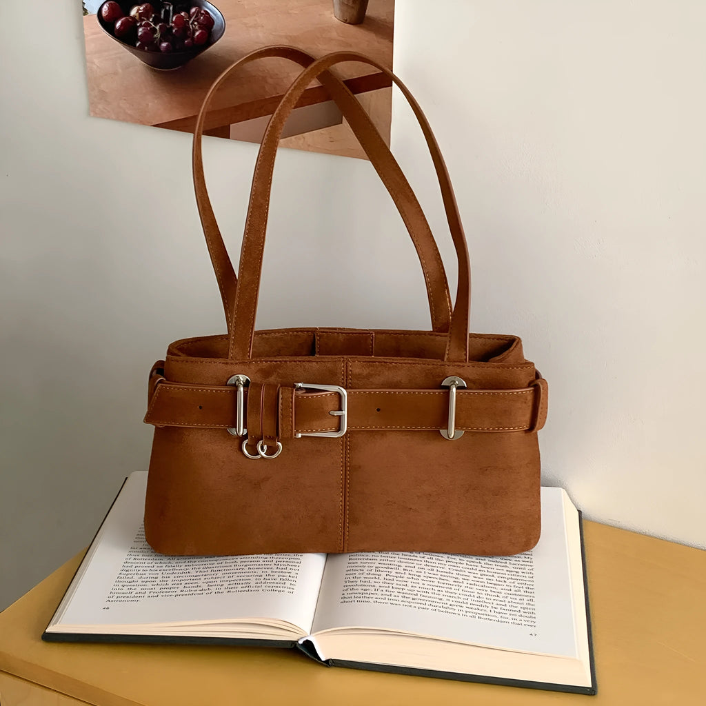 Retro minority design underarm bag in apricot colour with horizontal square shape and double shoulder straps.