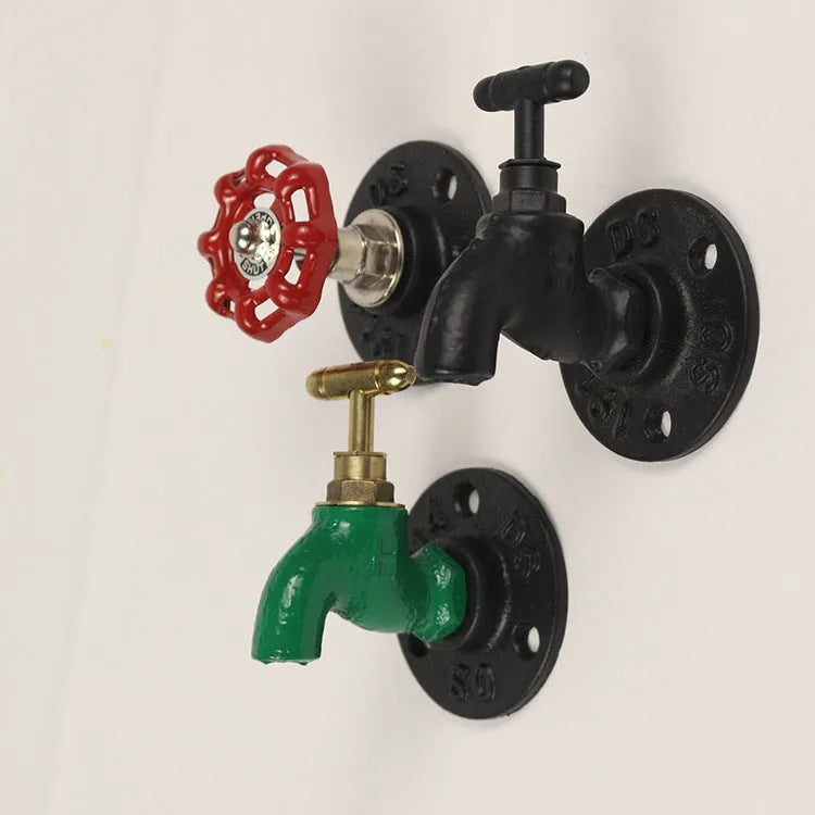 Metal water pipe style wall hanging hook in a choice of colours on a white wall.