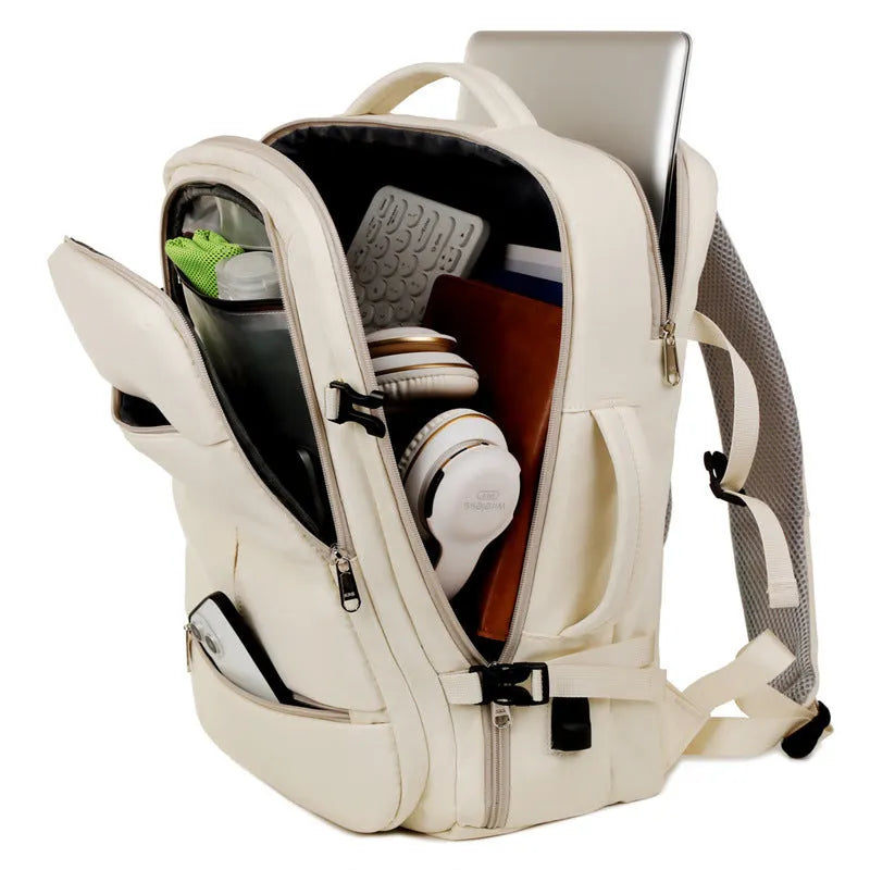 Waterproof Oxford cloth backpack with multiple pockets holding a 15.6 inch laptop