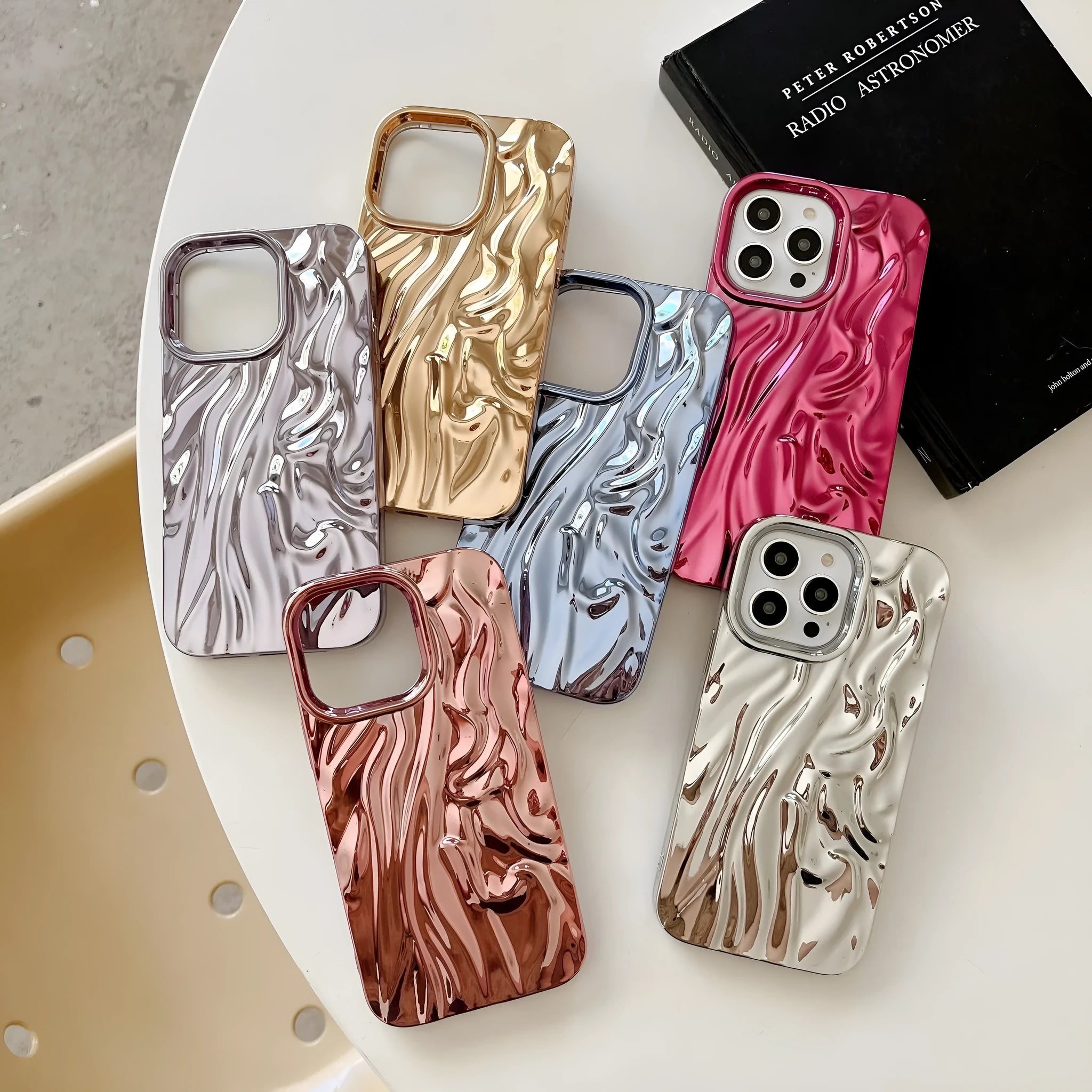 Soft TPU iPhone case with a textured three-dimensional pleated pattern in an electroplated silver finish.