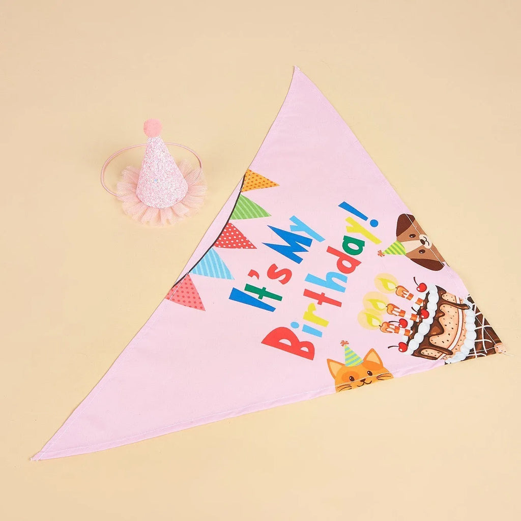 Printed polyester dog birthday hat and drool towel set in cartoon style with blue and pink colour options.