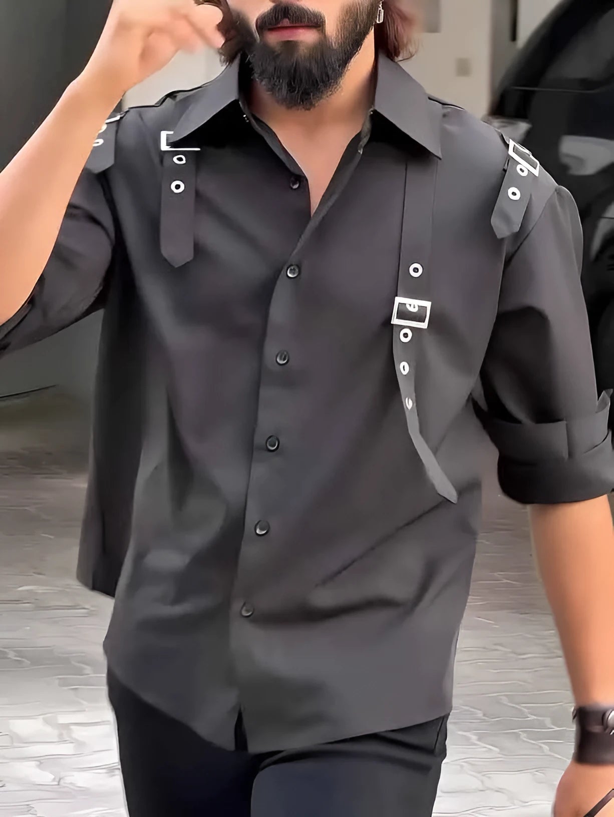 Man wearing a black utility-style button-up shirt with a regular fit.
