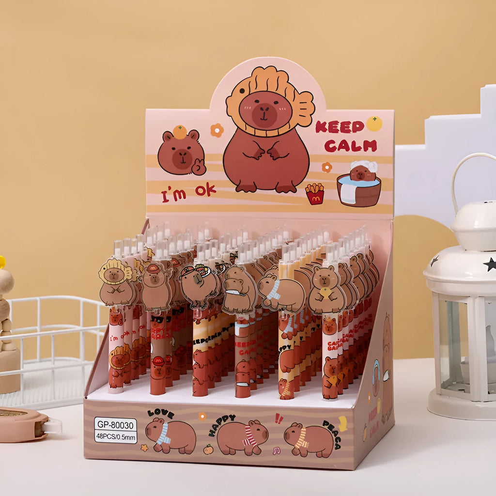 Open box showing 48 cartoon bear themed plastic gel pens with press barrels.
