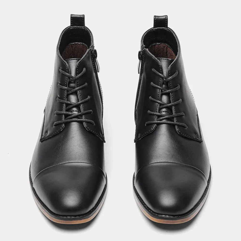 Men's brown Chelsea boot with a side zipper, round toe, and low wooden sole.