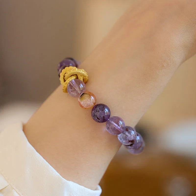 Purple cornucopia bracelet with nine purple crystals and zodiac animal design