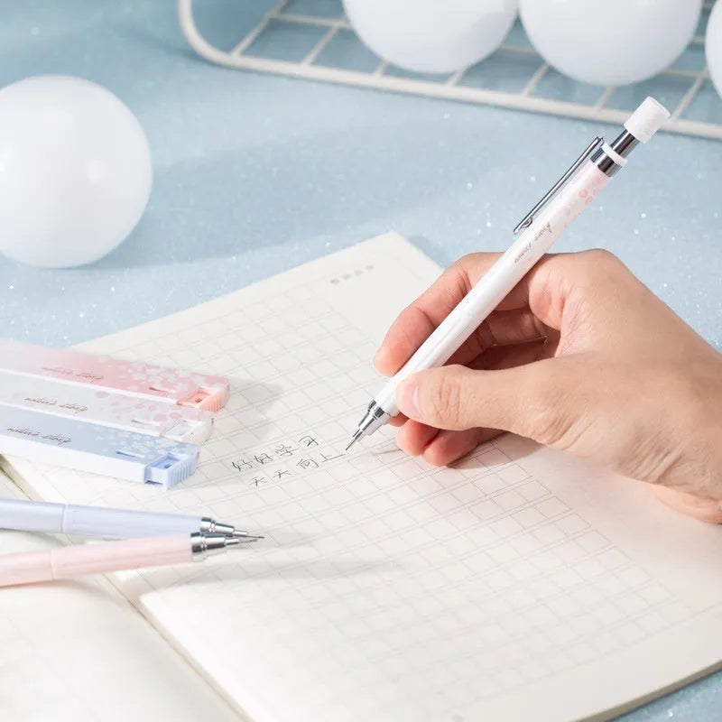 Sakura law style cartoon automatic pencil set with three 0.5mm pencils and HB refill boxes.