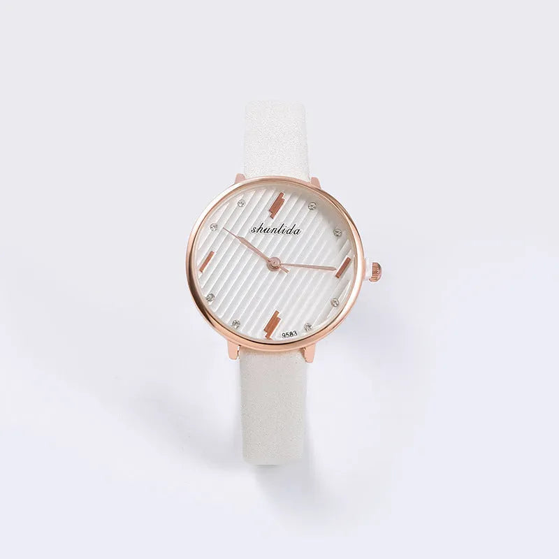 Trendy student watch with round white dial, 32mm diameter, stainless steel buckle on a light background